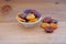 Plateful of Organic dried apricots and Spilled dried apricots on Wooden Background