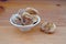 Plateful of Organic Dried figs and Spilled Dried figs on Wooden Background