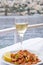 Plateful of Symi Shrimp Served ith a Slice of Lemon and a Glass of Greek White Wine