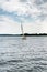 Plateliai Lithuania 08 24 2020 Old expensive vintage wooden sailboat sailing under dramatic sky before the thunderstorm