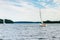 Plateliai Lithuania 08 24 2020 Old expensive vintage wooden sailboat sailing under dramatic sky before the thunderstorm