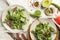 Plates with healthy vegetable salad on table