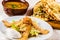 Plates with lunch dishes. Caesar salad, soup with chanterelles and flatbread