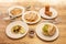 Plates of Mexican food, quesadillas, golden tacos, tacos al pastor, corn, cob,