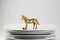 Plates stacked dishes and clean white horse and gold tableware,