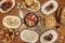 Plates and trays of typical recipes of Spanish gastronomy with croquette tapas, grilled ear, alioli potatoes, Andalusian squid,