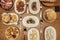 Plates and trays of typical recipes of Spanish gastronomy with croquette tapas, grilled ear, alioli potatoes, Andalusian-style