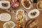 Plates and trays of typical Spanish gastronomy recipes with croquette tapas, grilled ear, alioli potatoes, Andalusian-style squid