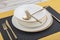 Plates and utensils, Plate, Bowl and golden cutlery on dining table, side view. Modern craft ceramic tableware, cutlery on the