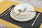Plates and utensils, Plate, Bowl and golden cutlery on dining table, side view. Modern craft ceramic tableware, cutlery on the