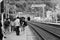 A platform crowded with waiting passengers for the local train service approaches from the tunnel at Monterosso railway station Li