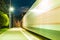 Platform of railway station and train in motion blur