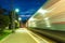 Platform of railway station and train in motion blur