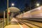 Platform of railway station and train in motion blur