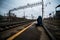 The platform of the railway station, trains, travel backpack is on the floor