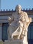 Plato, the ancient Greek philosopher in front of the national academy neoclassical building, Athens, Greece.