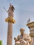 Plato the ancient philosopher and Athena mythical goddess marble statues