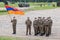 A platoon of soldiers of the army of armenia in hygienic masks with the flag of the republic of Armenia