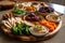 platter of assorted vegan delights: hummus, baba ghanoush, dolmeh and pita