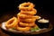 A platter of crispy onion rings. Generative AI