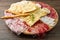 Platter of cured meats, cheeses and fried dumpling