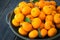 A platter of fresh orange Clementine tangerines