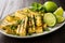 platter of grilled tofu and zesty lime wedges