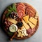 a platter of meats, cheeses, and crackers on a wooden platter with a knife and a bowl of olives. ge