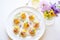 platter of mini eggs benedicts as appetizers for a party setting