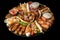 platter of mixed international fast food including kebab, sushi, and tacos