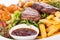 Platter of mixed meats, salad and French fries