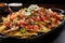 platter of nachos with well-dispersed layers of ingredients