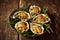 Platter of Oysters with Gratin Topping on Table