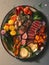 A platter of roasted vegetables and succulent slices of juicy steak.. AI generation