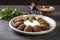 A platter of savory kibbeh, made with ground beef and bulgur wheat. (Generative AI)