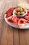 Platter of serrano jamon Cured Meat, Ciabatta, chorizo and olive