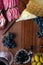 Platter with sliced Italian hard cheese pecorino toscano, homemade dried meat salami, glass of red wine, grape, olives on wooden b