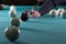 Play billiards. cue and billiard balls. hammer the ball into the hole