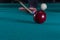 Play billiards. cue and billiard balls. hammer the ball into the hole