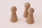 Play figures of wood on white background