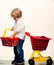 Play shop. Cute buyer customer client hold shopping cart. Kids store. Boy child shopping. Big purchase. Kid hold plastic