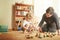 Play is a vital way of learning. Shot of a mother and her little son playing with wooden blocks at home.