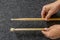 Play wooden sticks for drums