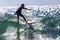 Playa del Carmen, Mexico March 13, 2023: Man surfing his board along the crest of the waves of the Caribbean Sea.