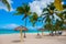 Playa Esmeralda, Holguin, Cuba. Caribbean sea. Beautiful Paradise beach: umbrellas, sea, palm trees, sand.