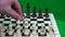 The player performs the first move with a white pawn for three squares ahead