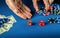 The player places a bet in a dice game or craps on a blue table in a casino. Luck or fortune in the poker club