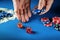 The player places a bet in a dice game or craps on a blue table in a poker club. Luck or fortune in the casino