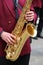 player plays the saxophone in the brass band