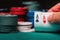 Player reveals one pair of aces in poker against the background of playing chips on the green table